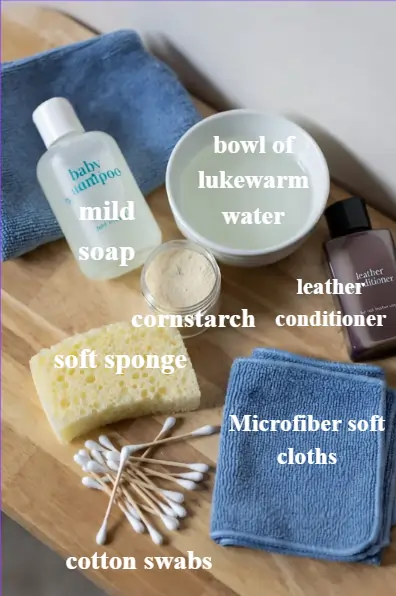 Flat lay of leather jacket cleaning tools arranged neatly on a table